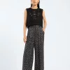 Model wearing a Black dotted pants cotton loose-fit black pants