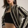 "Women's deep black striped two-piece outfit featuring a button-down collar top and matching flared viscose pants – monochrome coord set"
