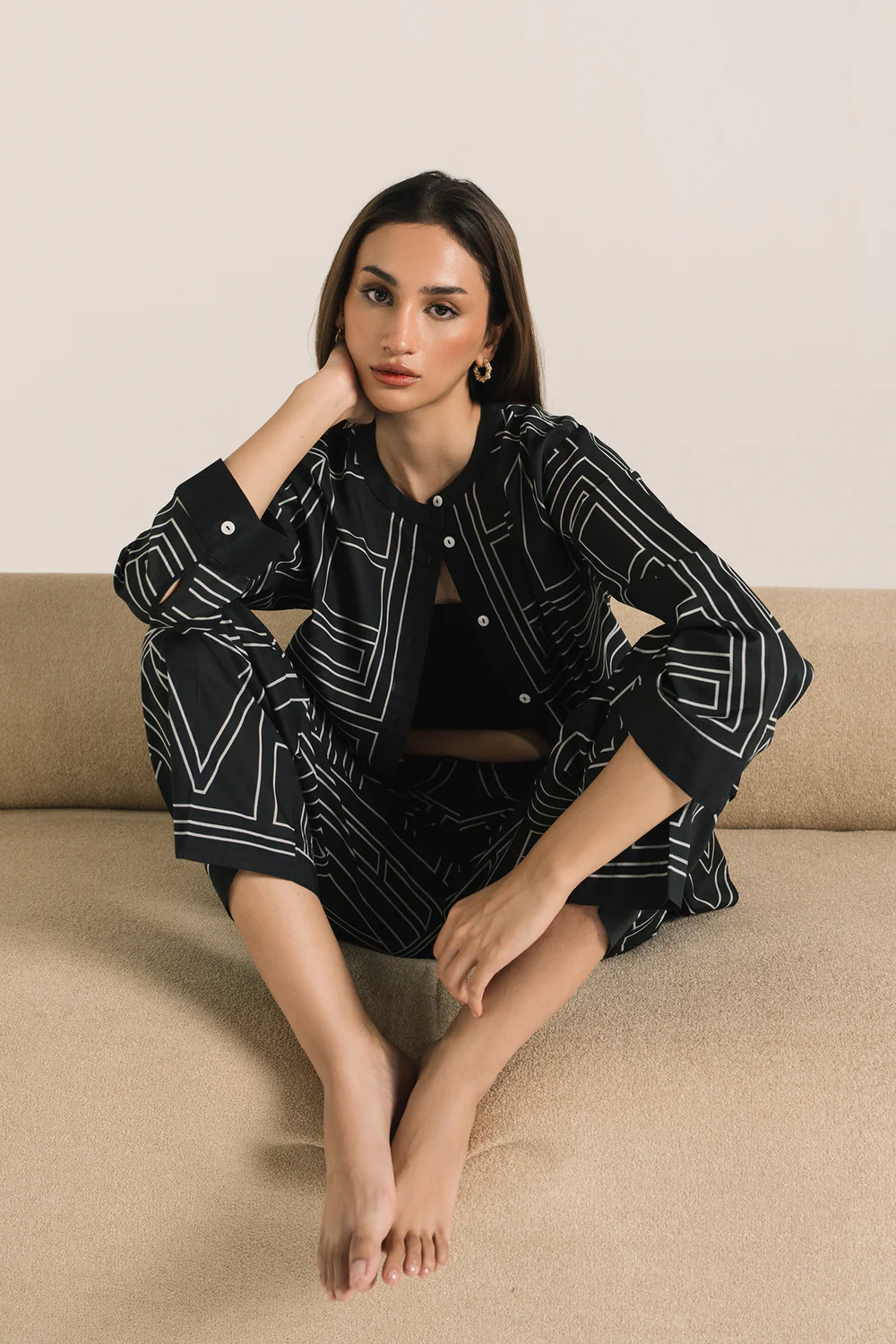 "Women's jet black two-piece outfit with white geometric print, featuring a button-down ban neck top and straight-fit long pants – modern coord set"