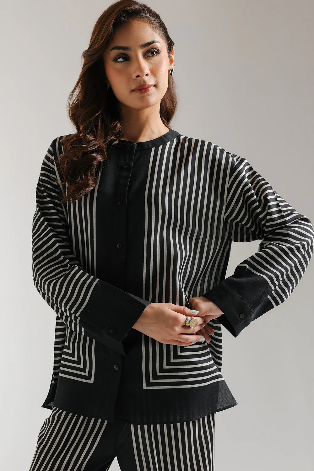 "Women's grey co-ord set with black geometric striped print, featuring a button-down ban neck top and matching straight-fit long pants – modern 2-piece outfit"