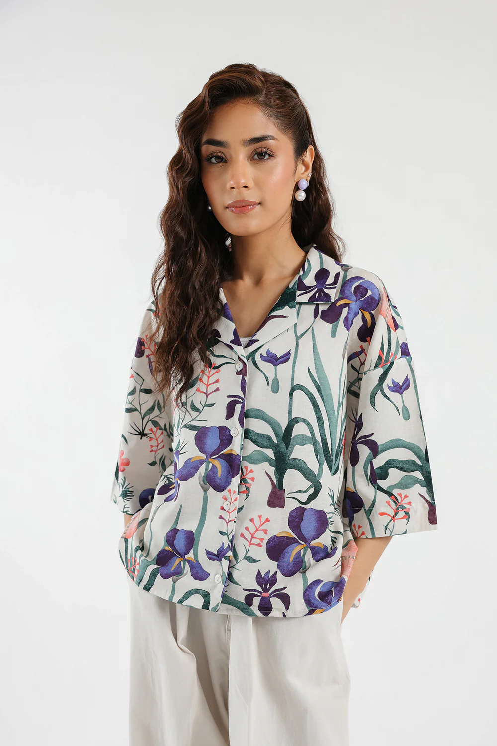 "Women's white cropped shirt with colorful floral print, button-down front, and cotton linen fabric – stylish party-ready 1-piece top"