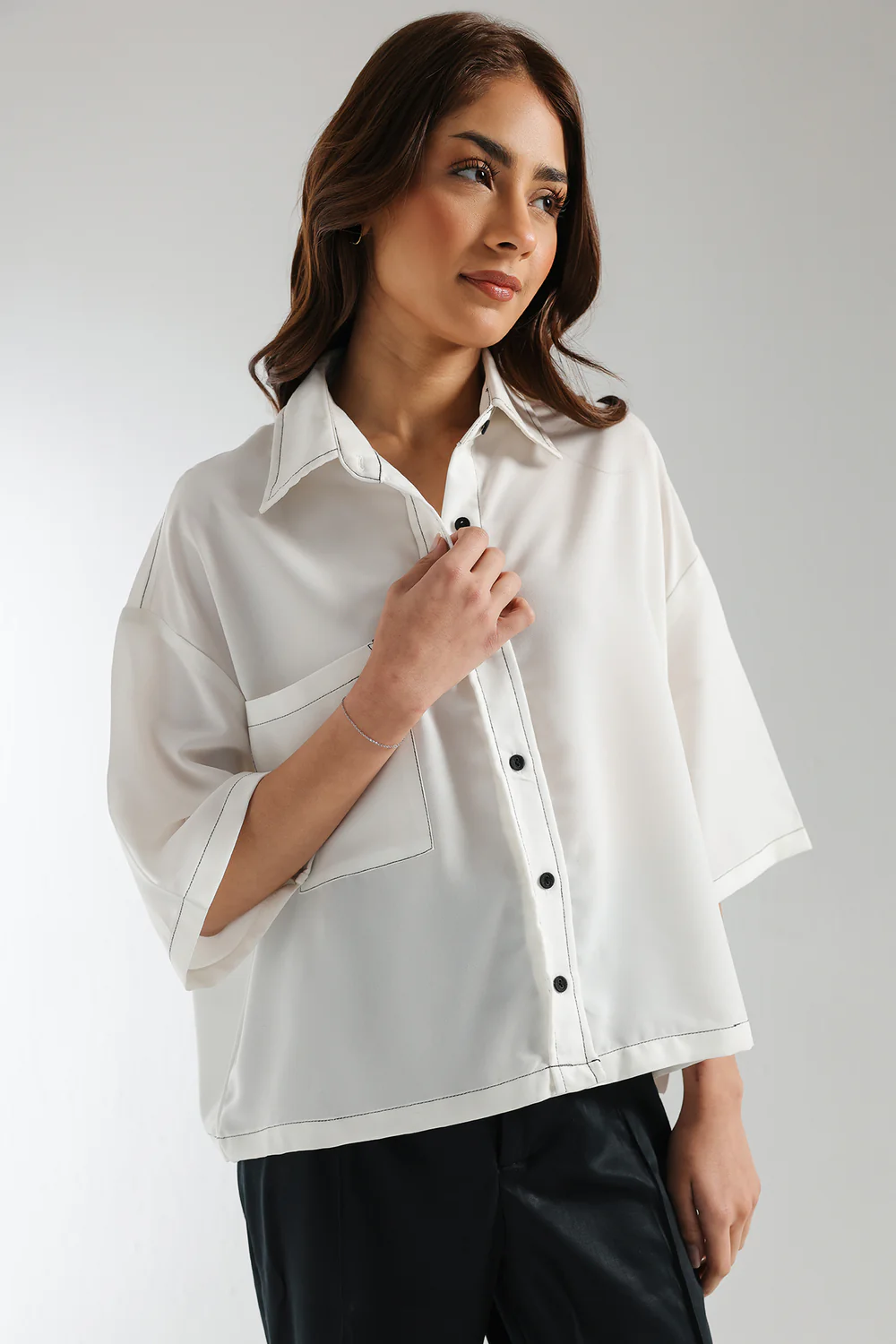 "Women's white boxy fit shirt with front pocket and black contrast stitching – trendy button-down viscose top for day events"