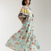 Front view of pale green floral print dress with gathered waist
