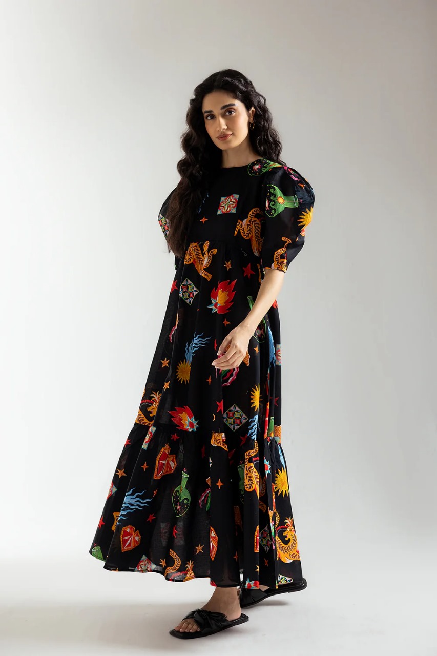 Side profile showing gathered waist and airy silhouette of the dress