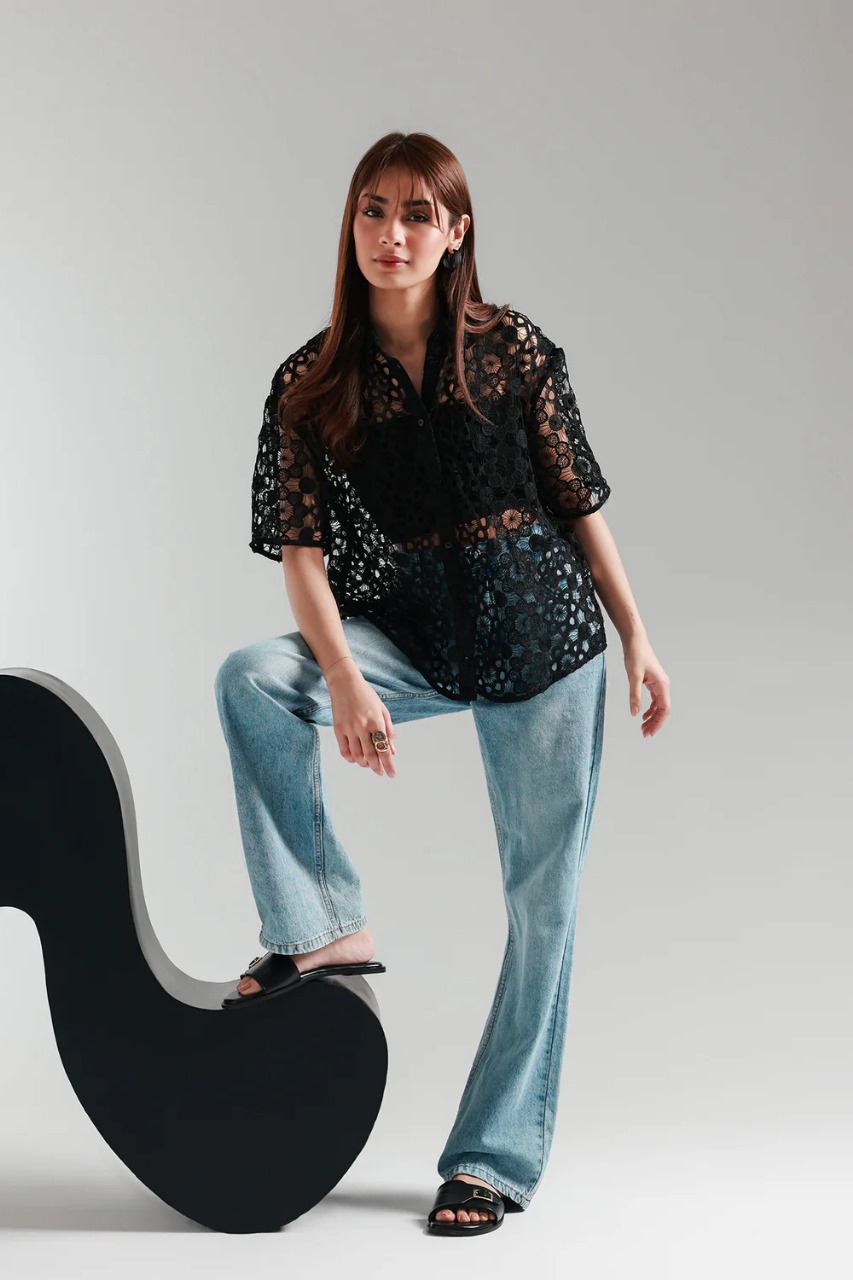 Front view of black cutwork net button-down women’s top