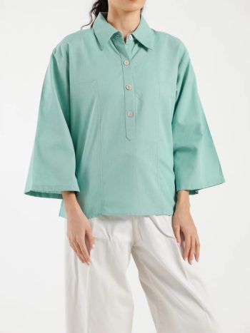 Close-up of collar and buttons on women’s sea green shirt